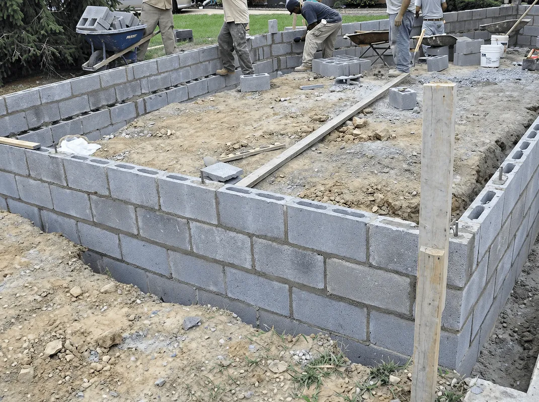 Professionals building a foundation with blocks in Tempe, AZ