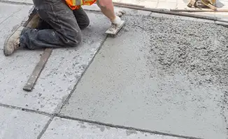 Professional repairing a concrete floor in Tempe, AZ